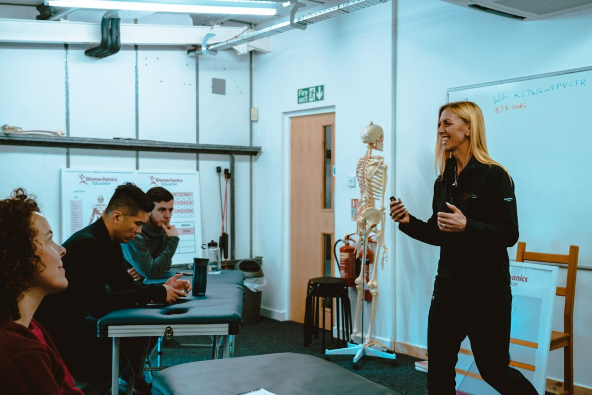 Biomechanics coach assessing client movement patterns