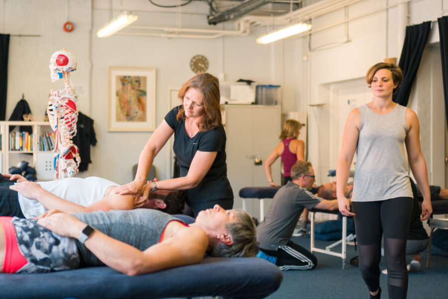 person performing a movement in an imovefreely workshop